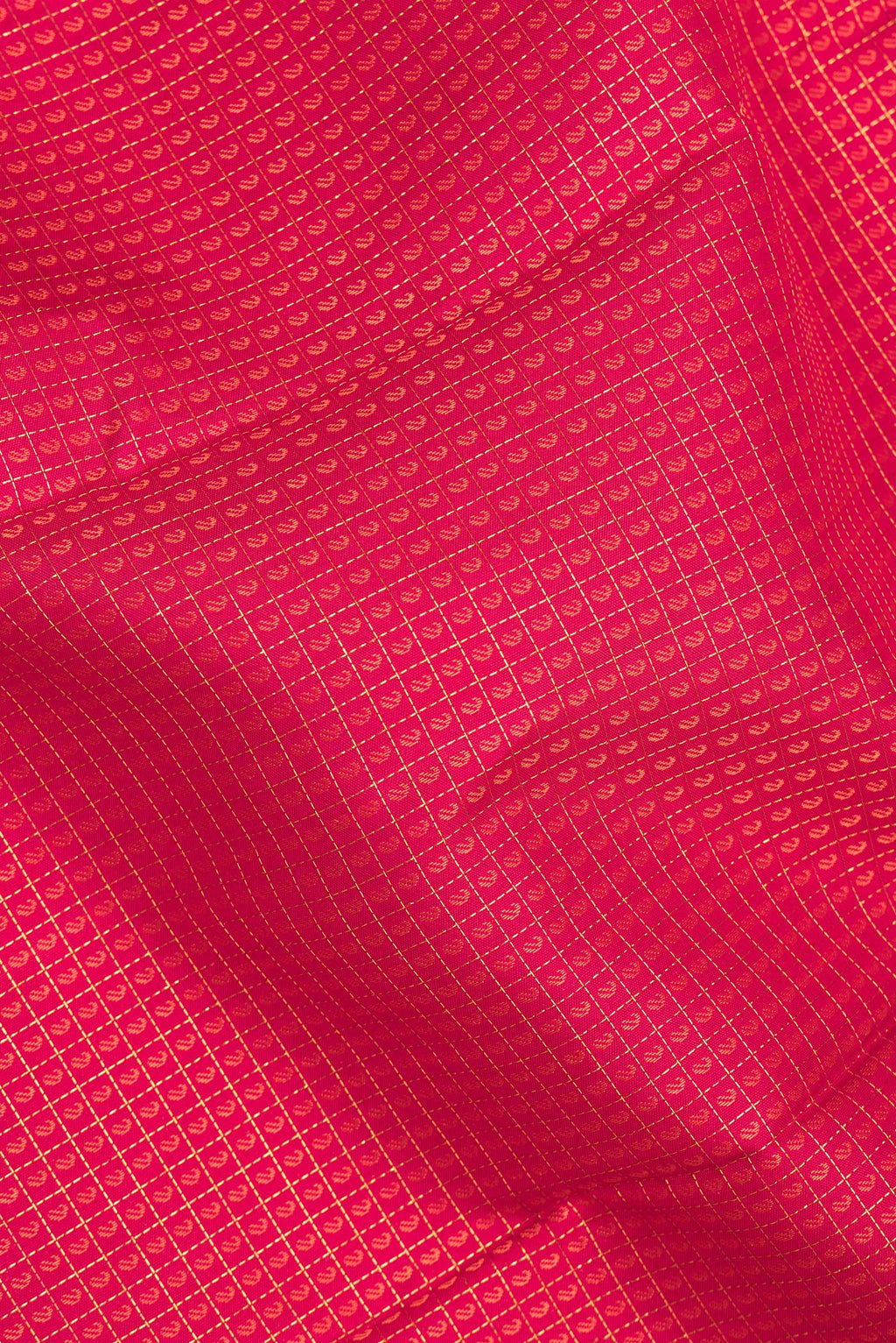 Close up of Pure Silk Dark Pink Kanjivaram Saree with Jacquard With Zari Butta on the body and Zari Border.  displaying folds