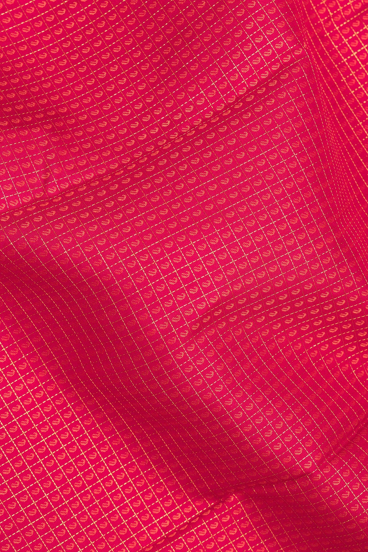 Close up of Pure Silk Dark Pink Kanjivaram Saree with Jacquard With Zari Butta on the body and Zari Border.  displaying folds