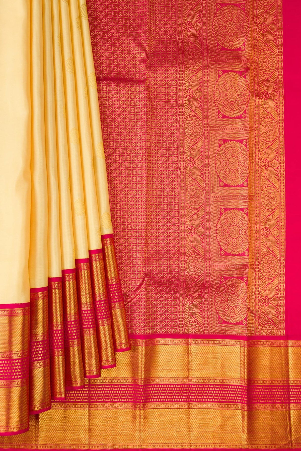 Pleats and pallu of Pure Silk Sandal Kanjivaram Saree with Zari Butta on the body and Zari Border. 