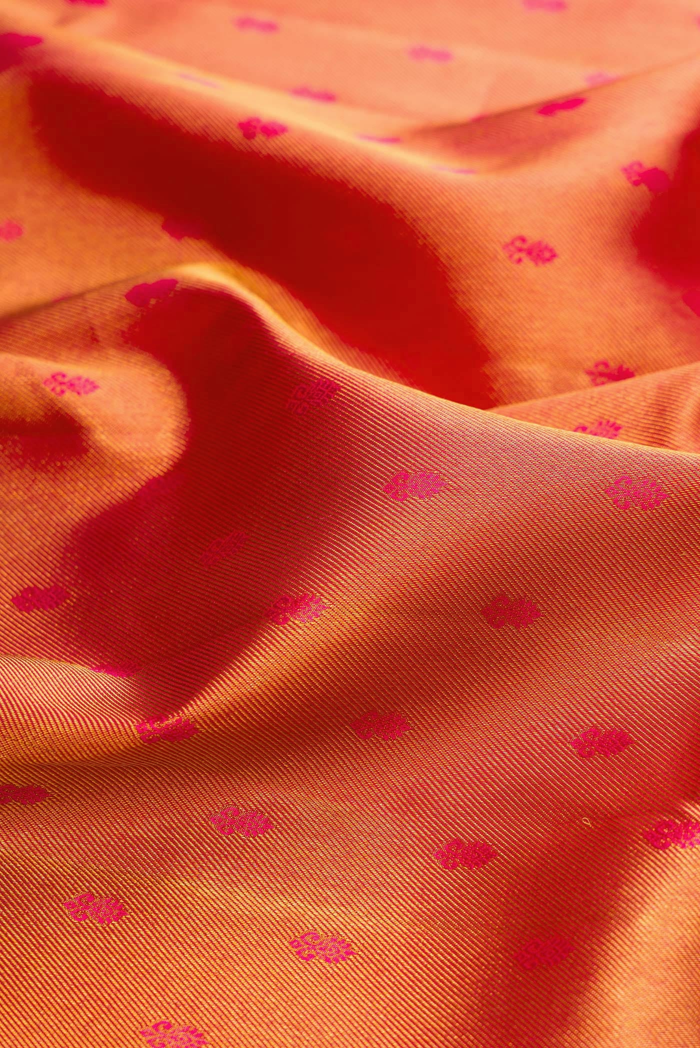 Close up of Red Dual Tone Kanjivaram Silk Saree with Zari Brocade on the body and Zari Border.  displaying folds