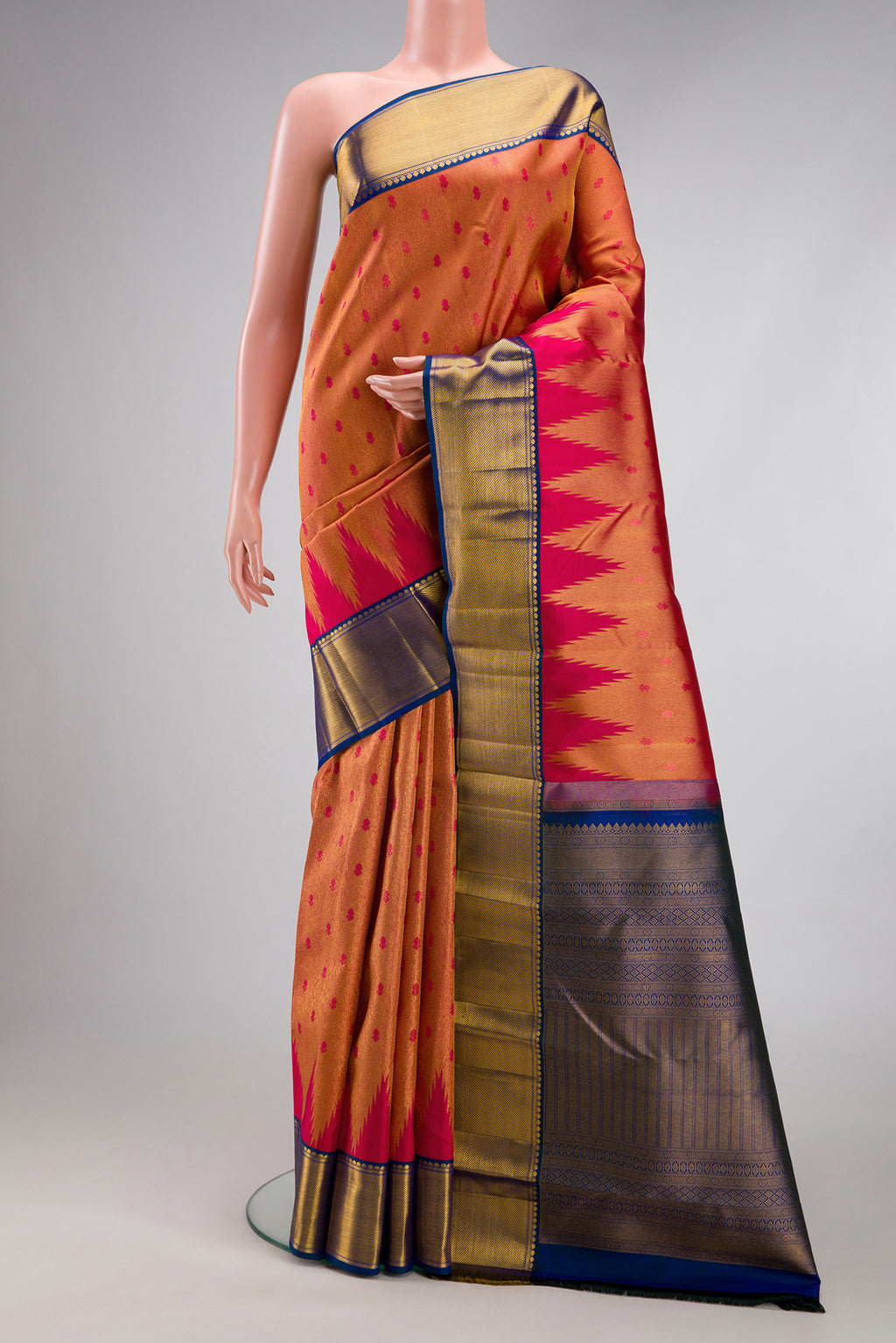 Red Dual Tone Kanjivaram Silk Saree with Zari Brocade on the body and Zari Border.  displayed on a mannequin