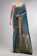 Pure Silk Peacock Blue Dual Tone Kanjivaram Saree with Checked design on the body and Zari Border.  displayed on a mannequin