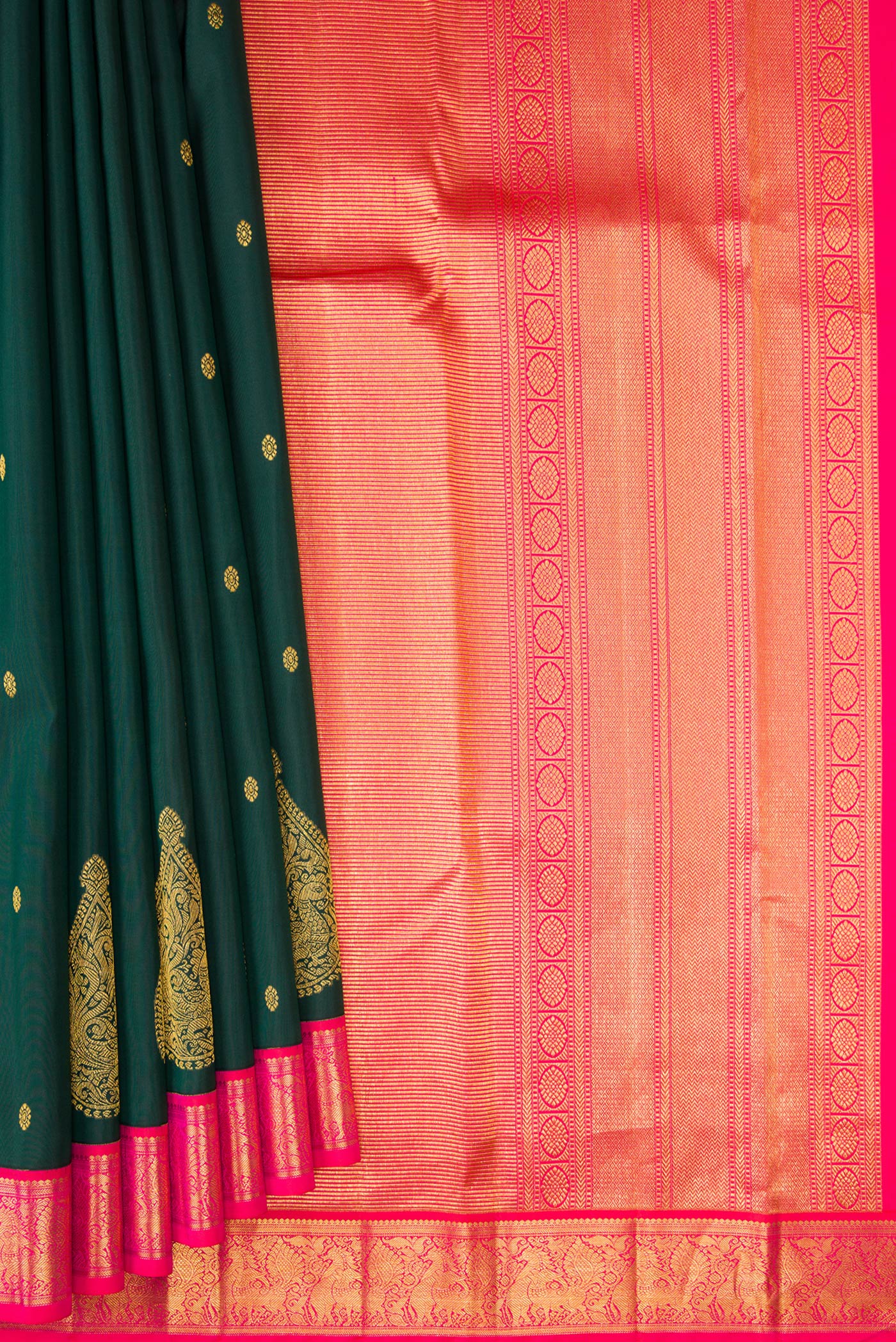 Pleats and pallu of Bottle Green Kanchipuram Silk Saree with Zari Butta on the body and Fancy Border. 