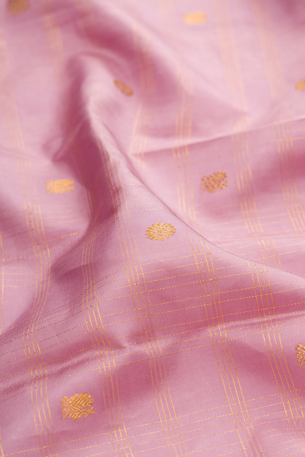 Close up of Lavender Kanchipuram Silk Saree with Checked design on the body and Without Border.  displaying folds