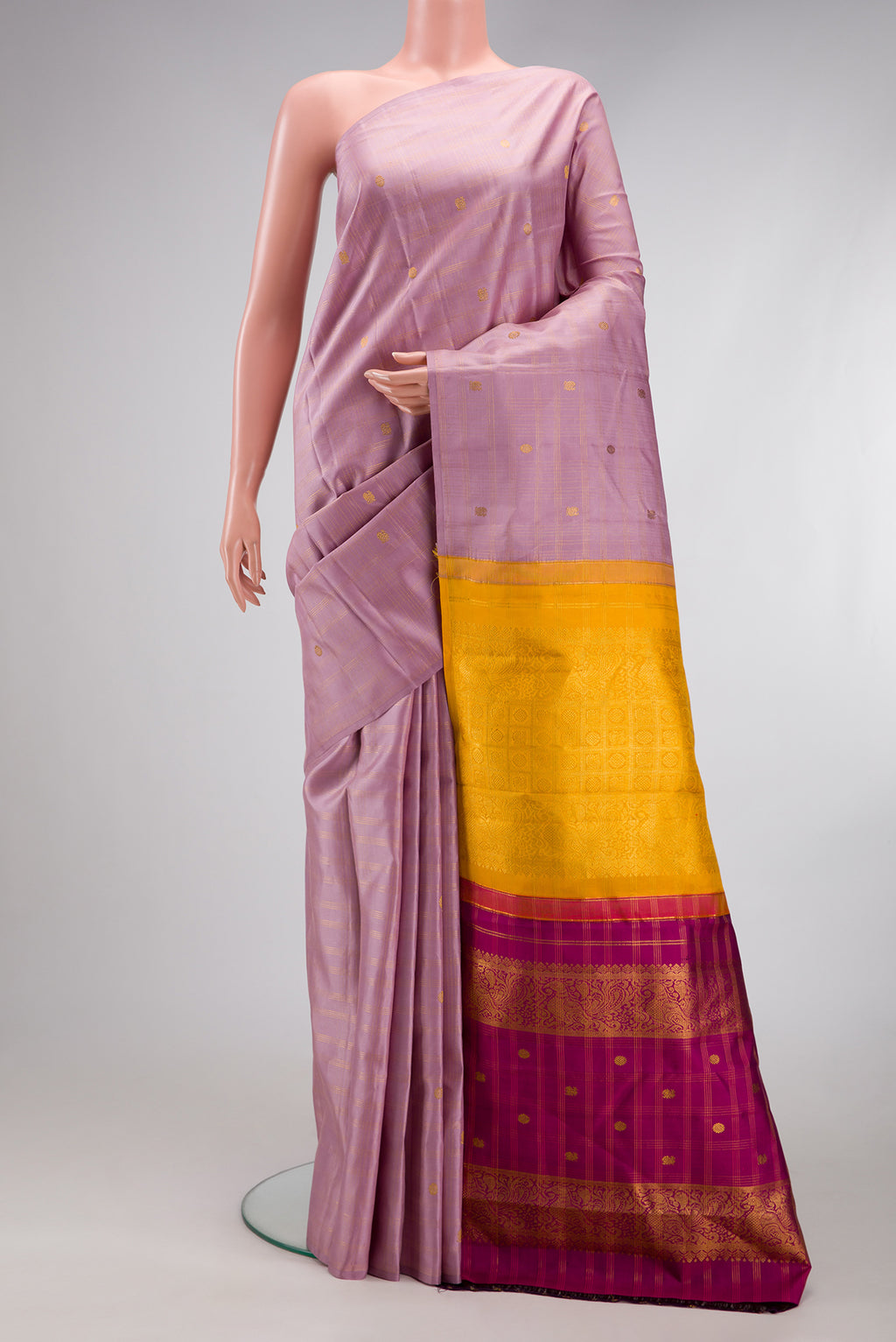 Lavender Kanchipuram Silk Saree with Checked design on the body and Without Border.  displayed on a mannequin