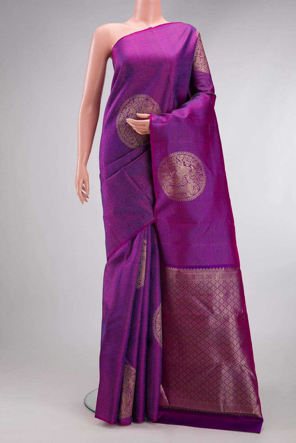 Purple Kanjivaram Silk Saree with Zari Butta on the body and Without Border.  displayed on a mannequin