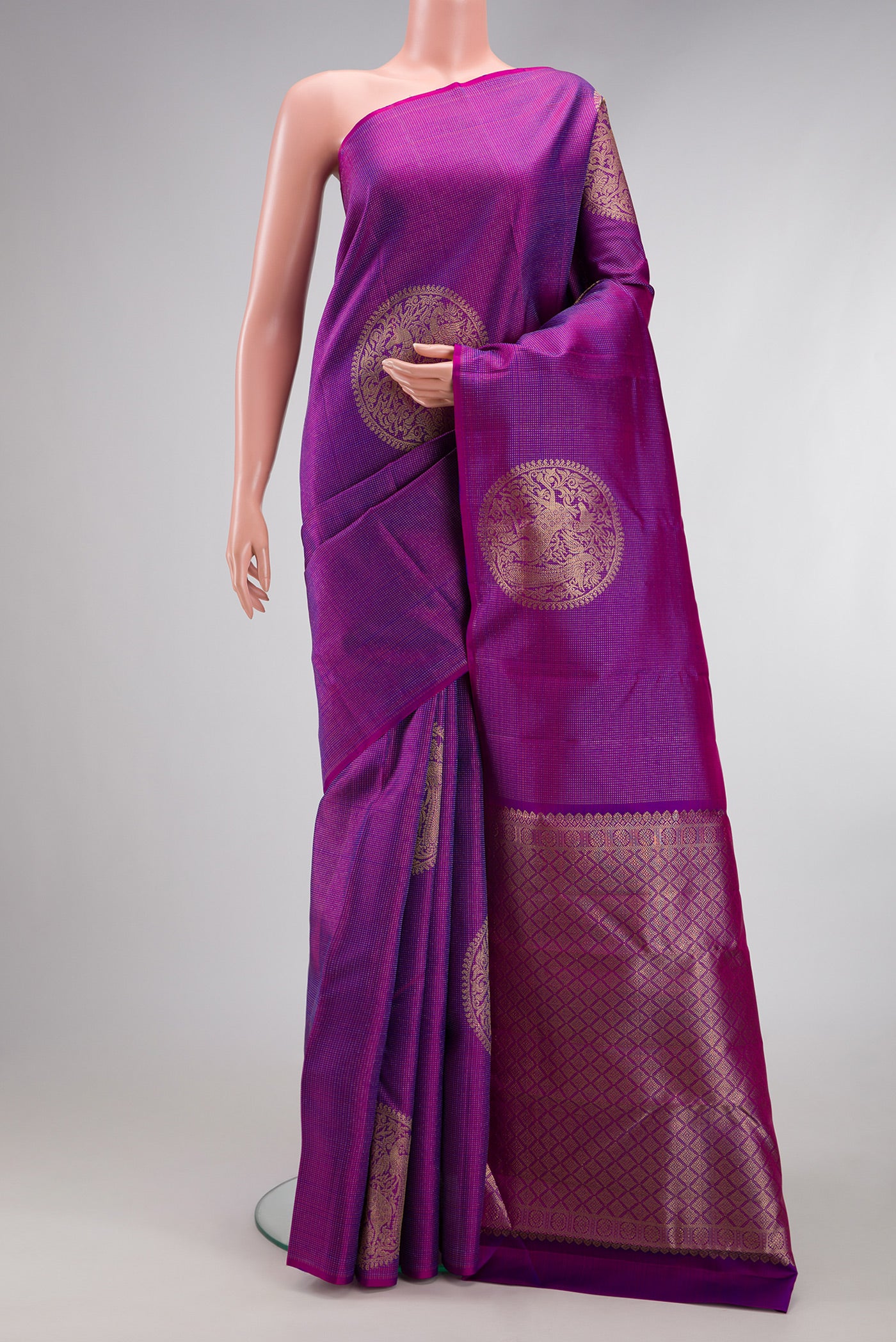 Purple Kanjivaram Silk Saree with Zari Butta on the body and Without Border.  displayed on a mannequin