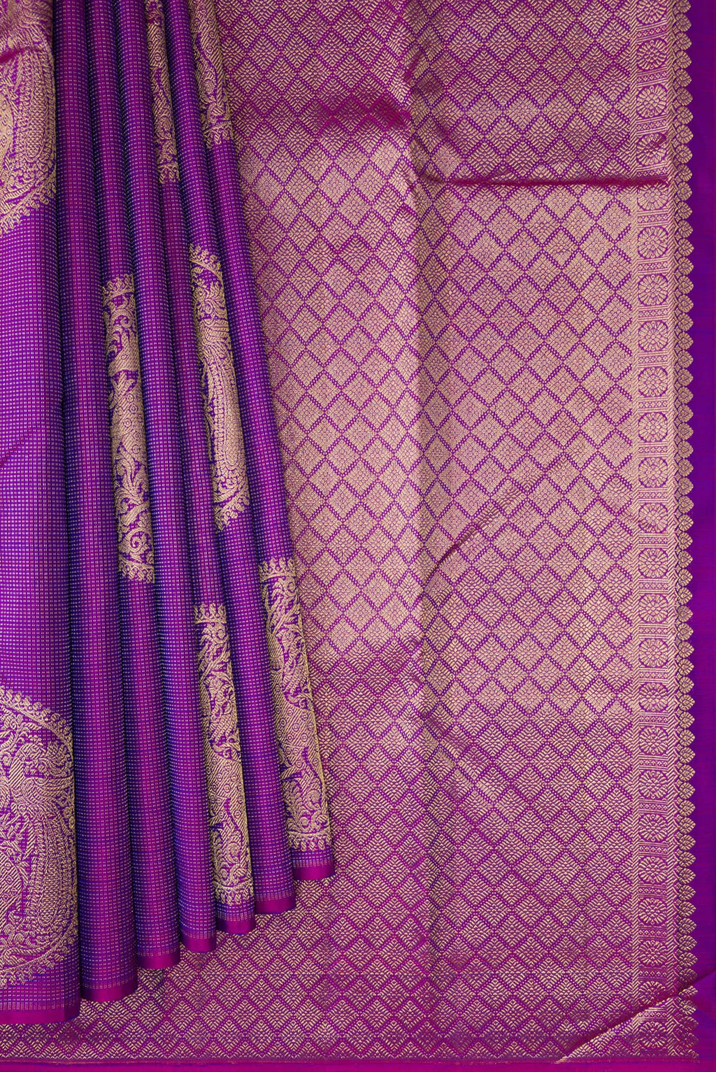 Pleats and pallu of Purple Kanjivaram Silk Saree with Zari Butta on the body and Without Border. 