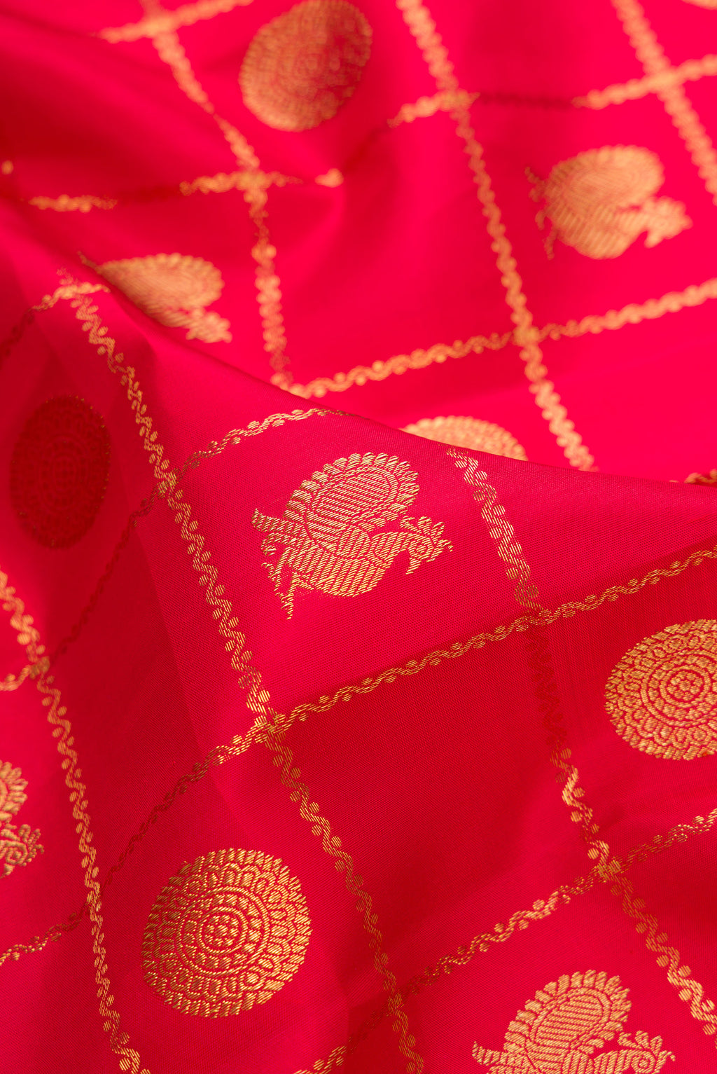 Close up of Pure Silk Pure Zari Red Kanjivaram Saree with Checked design on the body and Zari Border.  displaying folds
