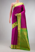 Pure Silk Pure Zari Magenta Dual Tone Kanjivaram Saree with Stripes on the body and Zari Border.  displayed on a mannequin