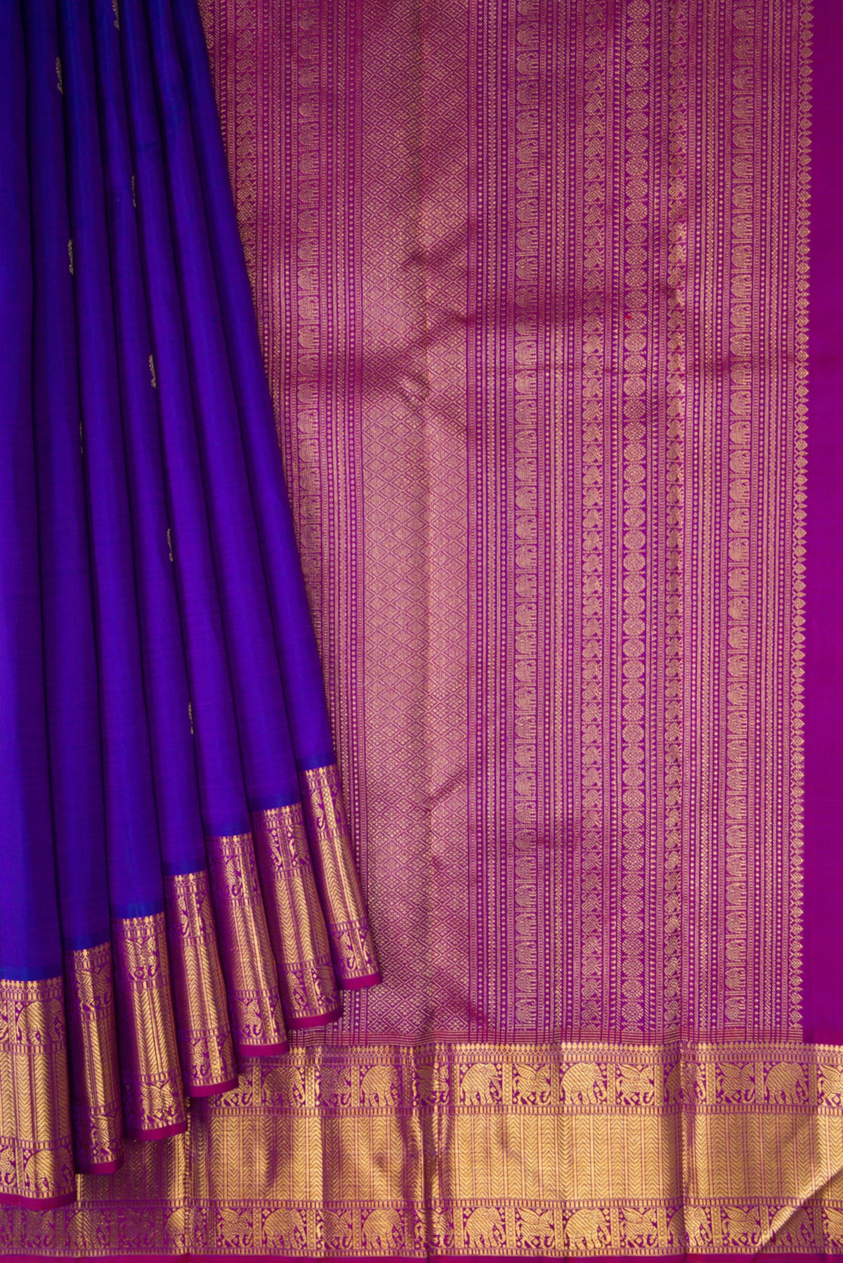 Pleats and pallu of Pure Silk Pure Zari Royal Blue Kanjivaram Saree with Zari Butta on the body and Zari Border. 