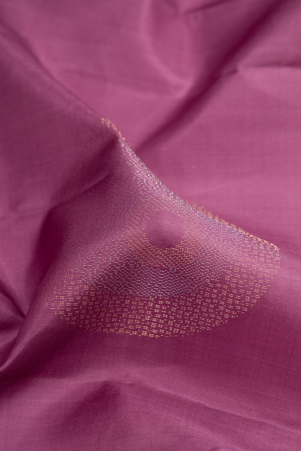 Close up of Purple Soft Silk Saree with Zari Butta on the body and Without Border.  displaying folds