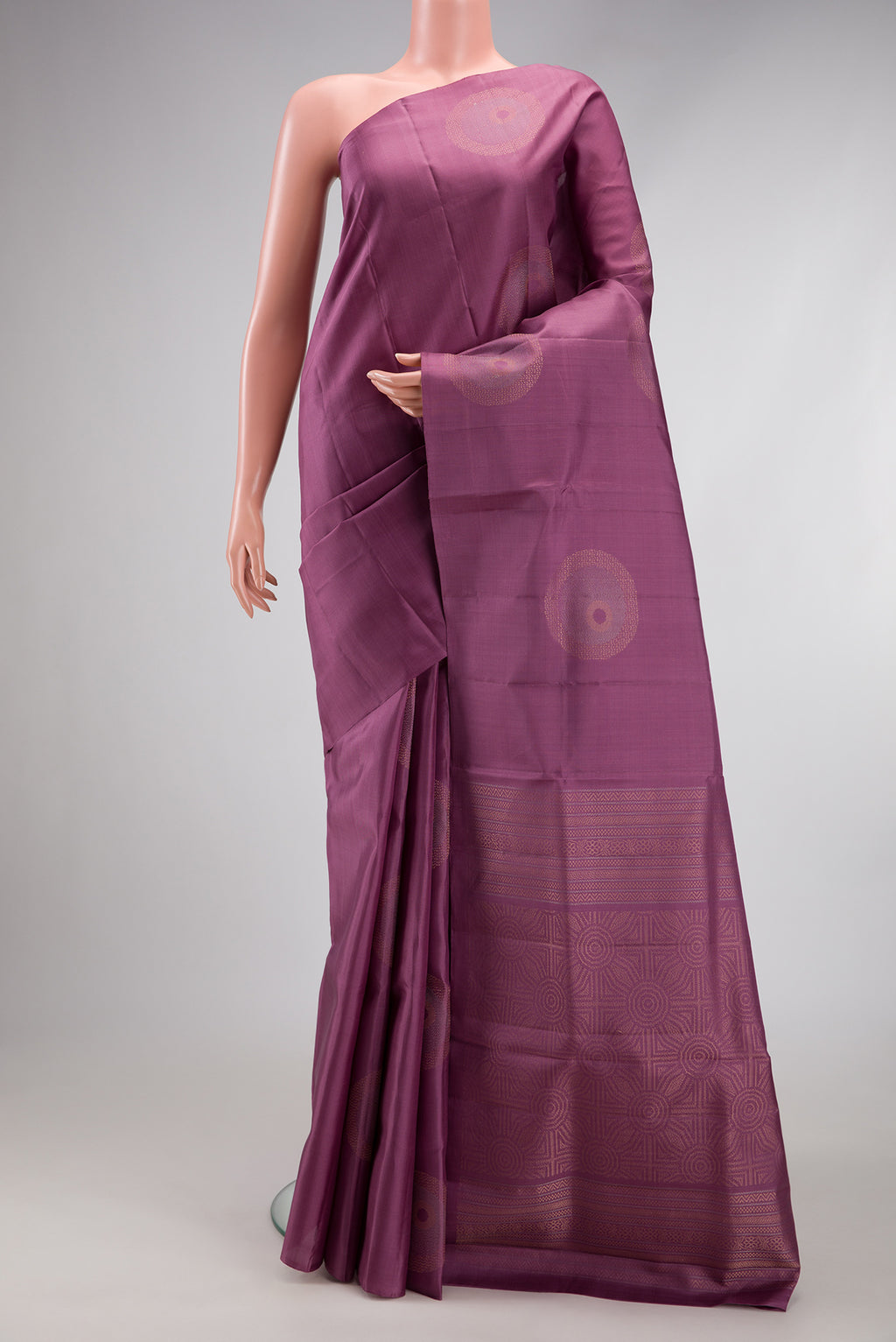 Purple Soft Silk Saree with Zari Butta on the body and Without Border.  displayed on a mannequin