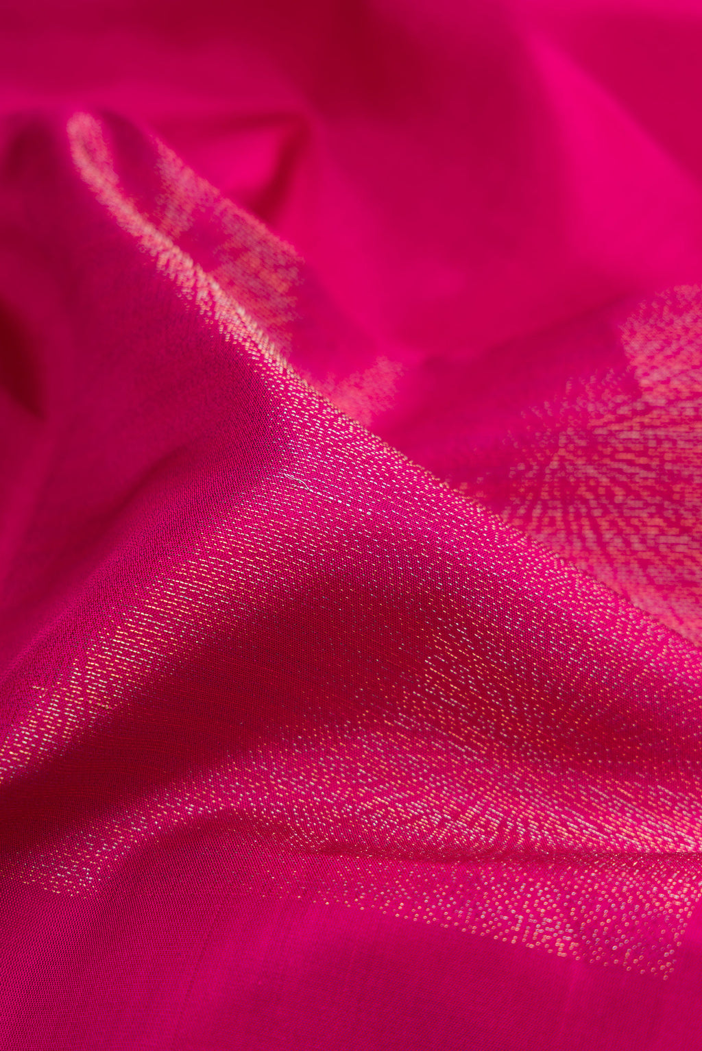 Close up of Dark Pink Soft Silk Saree with Zari Butta on the body and Without Border.  displaying folds