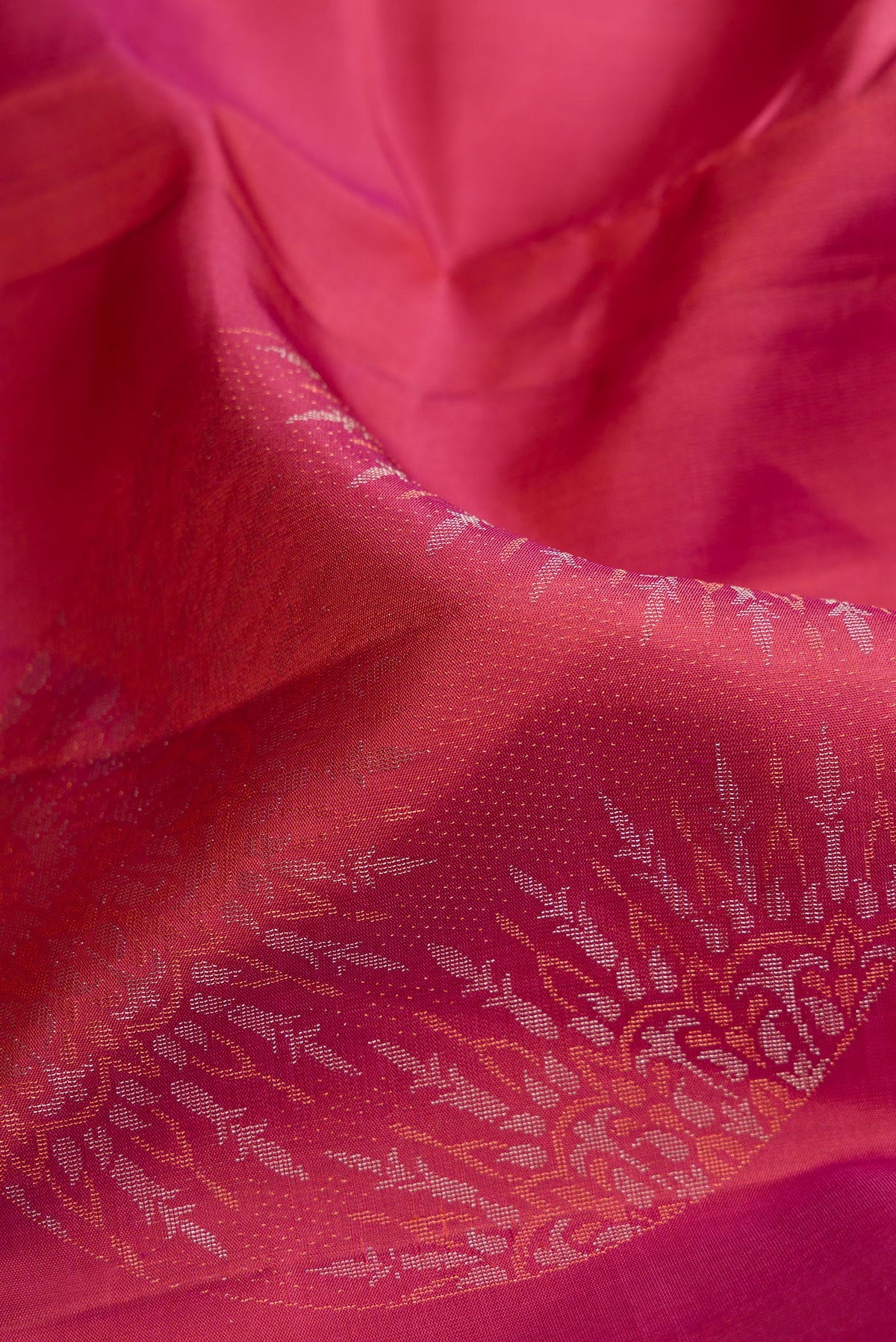 Close up of Mauve Dual Tone Soft Silk Saree with Zari Butta on the body and Without Border.  displaying folds