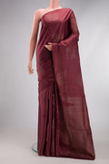 Dark Mauve Soft Silk Saree with Zari Butta on the body and Without Border.  displayed on a mannequin
