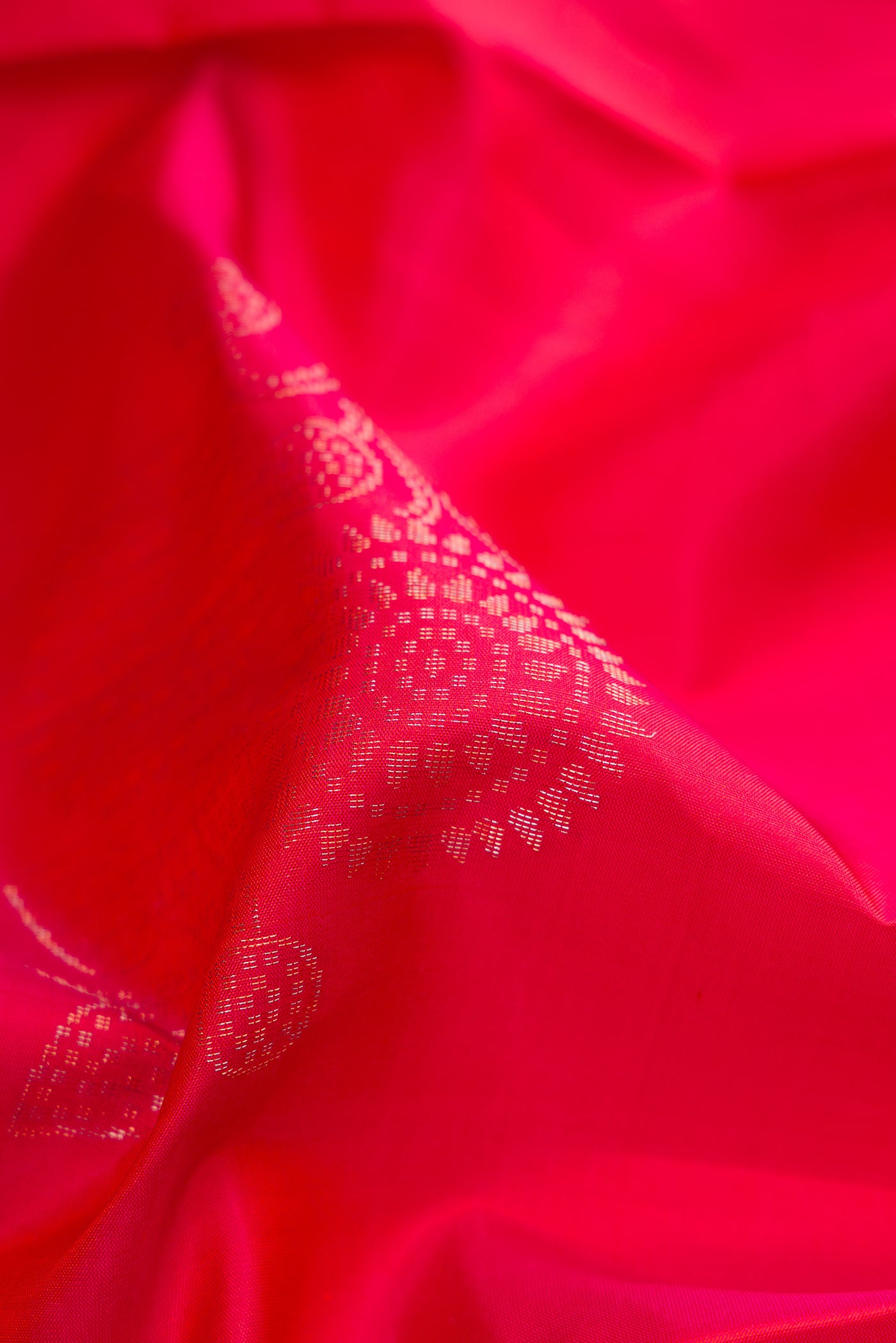 Close up of Pink Dual Tone Soft Silk Saree with Zari Butta on the body and Without Border.  displaying folds