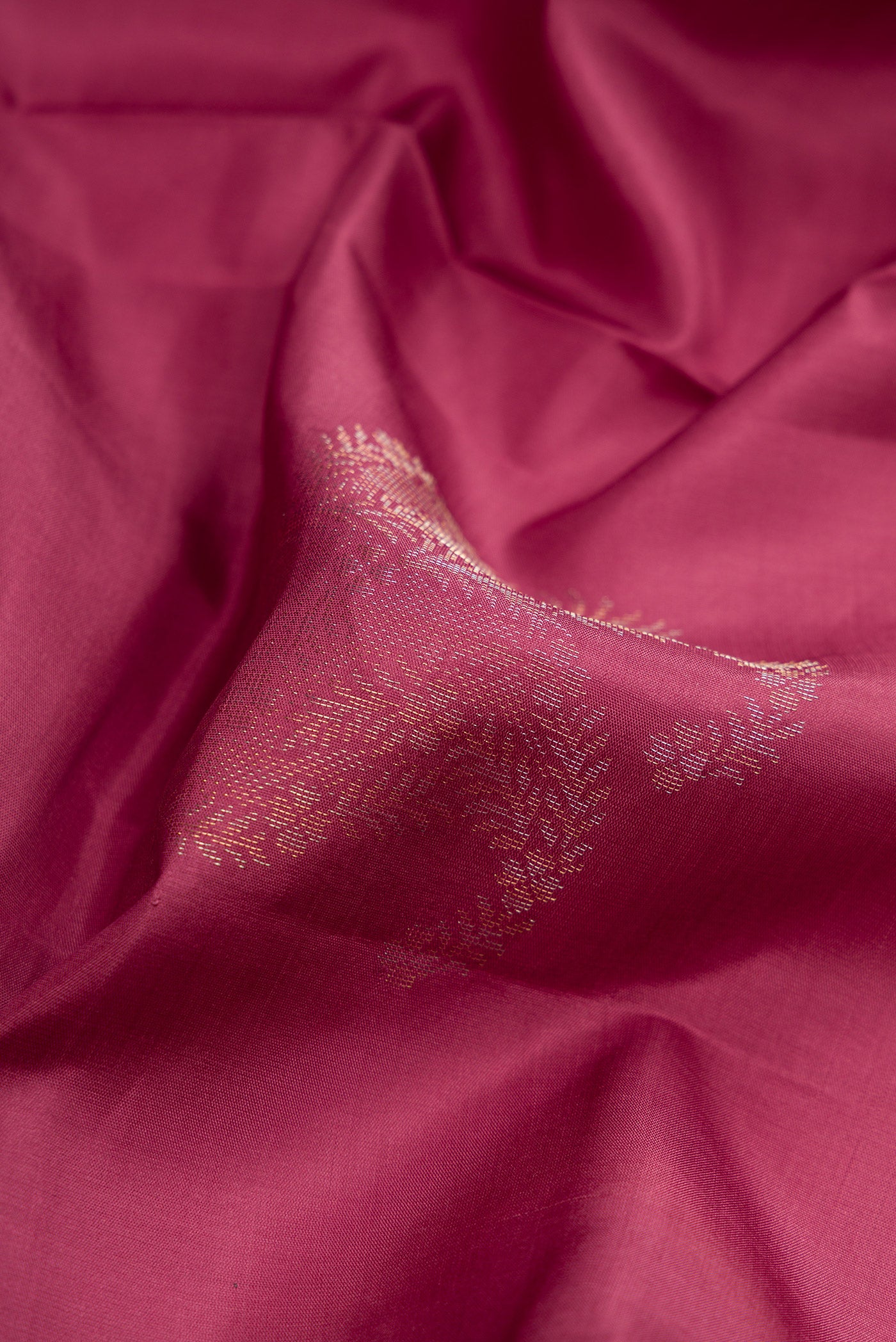 Close up of Mauve Soft Silk Saree with Zari Butta on the body and Without Border.  displaying folds