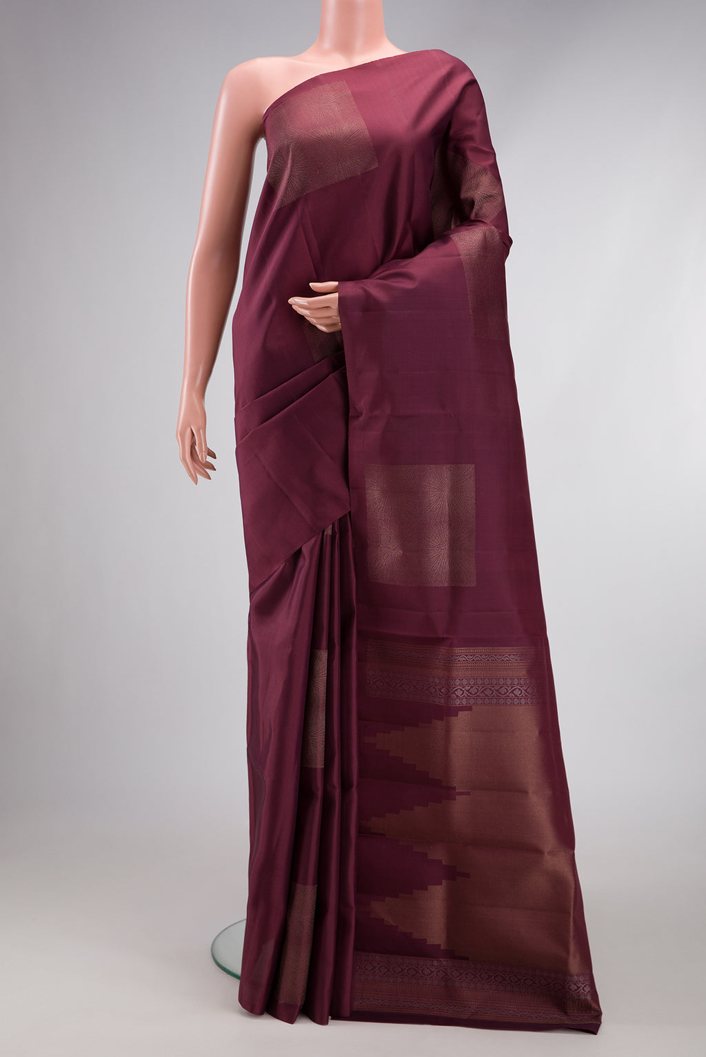 Coffee Brown Soft Silk Saree with Zari Butta on the body and Without Border.  displayed on a mannequin