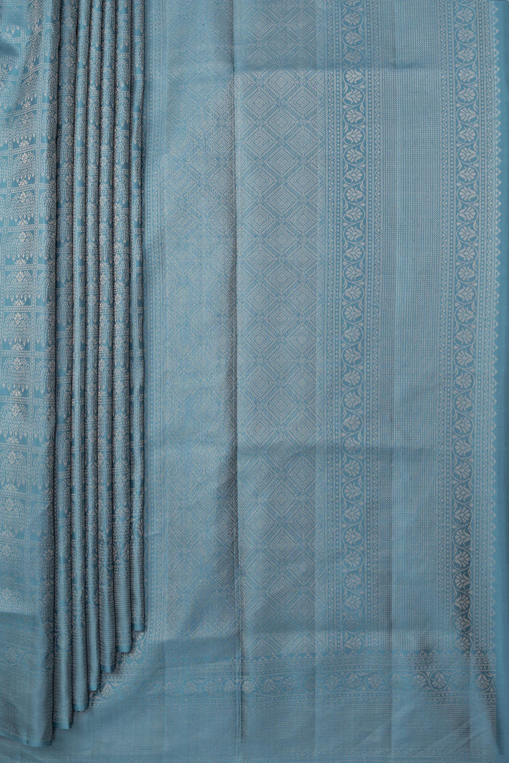 Pleats and pallu of Pure Silk Blue Grey Soft Saree with Zari Brocade on the body and Fancy Border. 