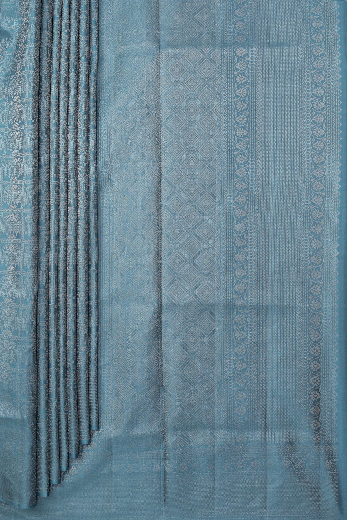 Pleats and pallu of Pure Silk Blue Grey Soft Saree with Zari Brocade on the body and Fancy Border. 