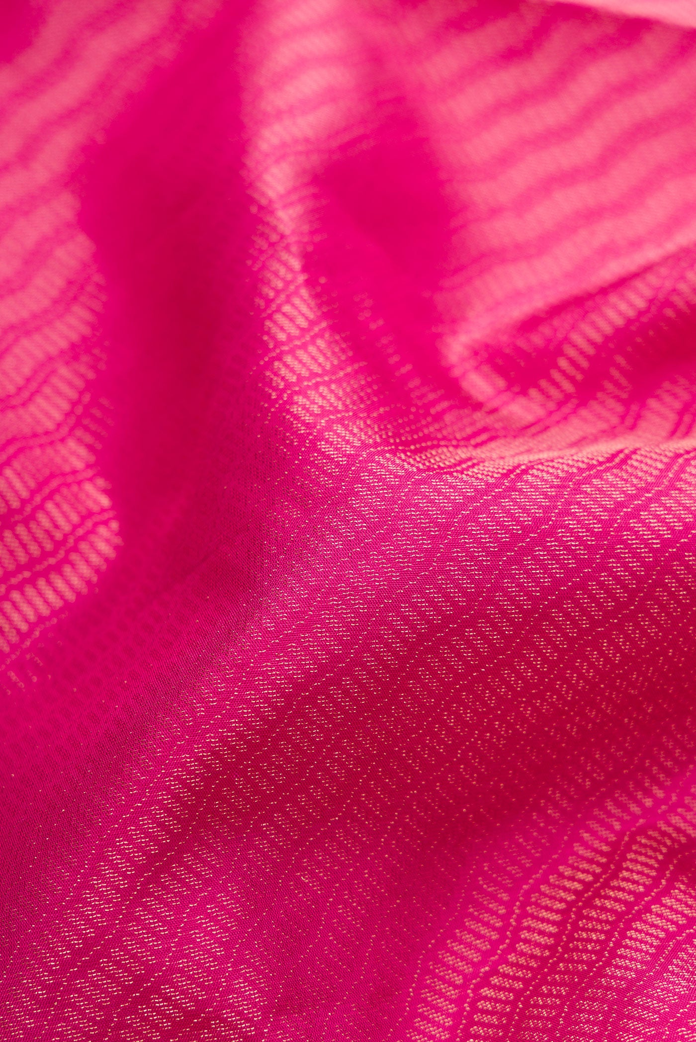 Close up of Pink Soft Silk Saree with Zari Brocade on the body and Fancy Border.  displaying folds