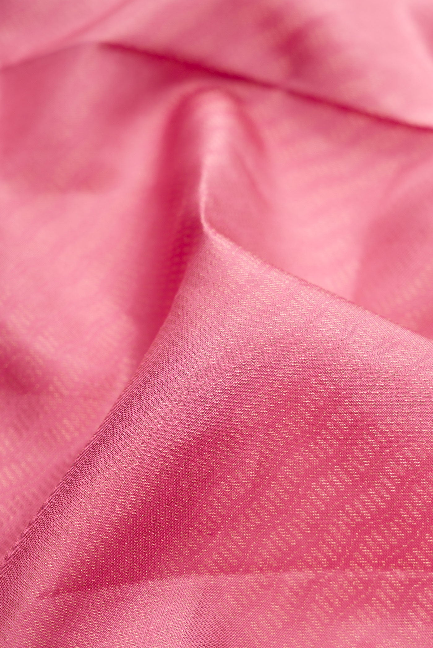 Close up of Rose pink Soft Silk Saree with Zari Brocade on the body and Fancy Border.  displaying folds