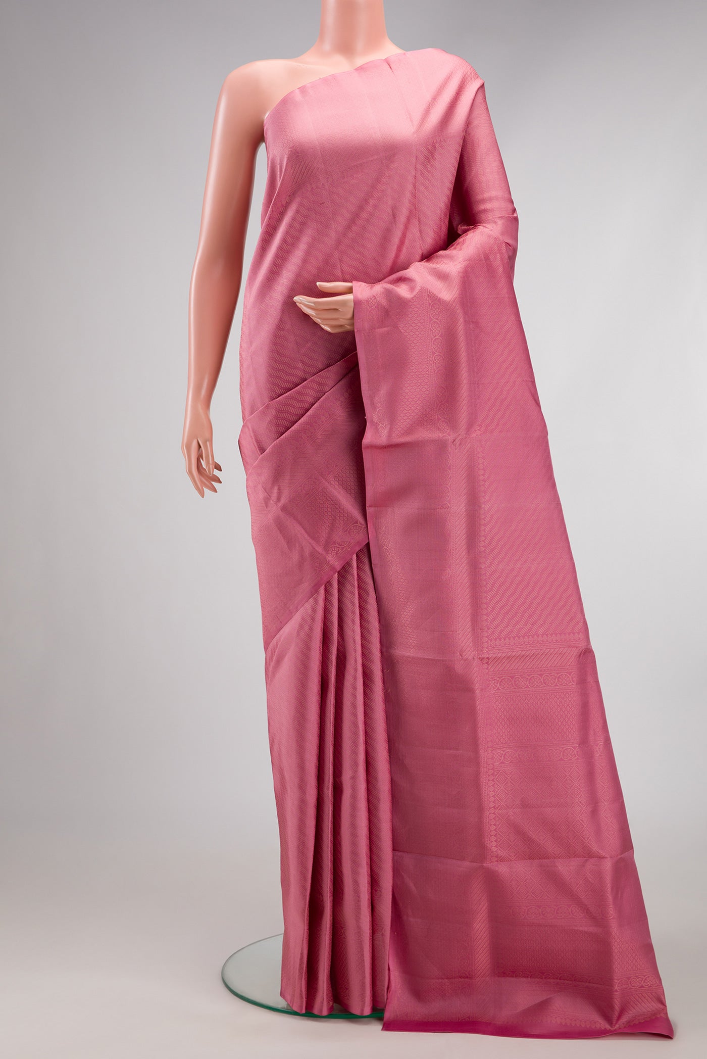 Rose pink Soft Silk Saree with Zari Brocade on the body and Fancy Border.  displayed on a mannequin