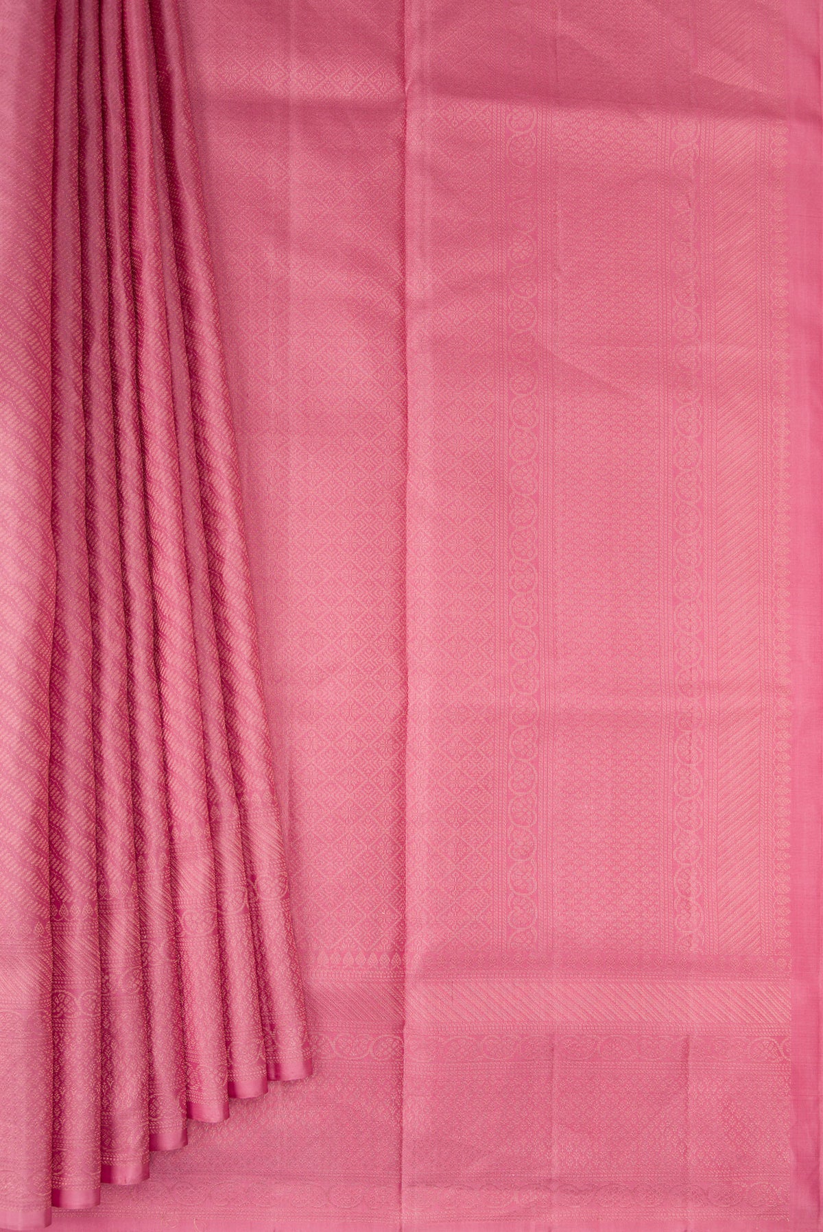 Pleats and pallu of Rose pink Soft Silk Saree with Zari Brocade on the body and Fancy Border. 