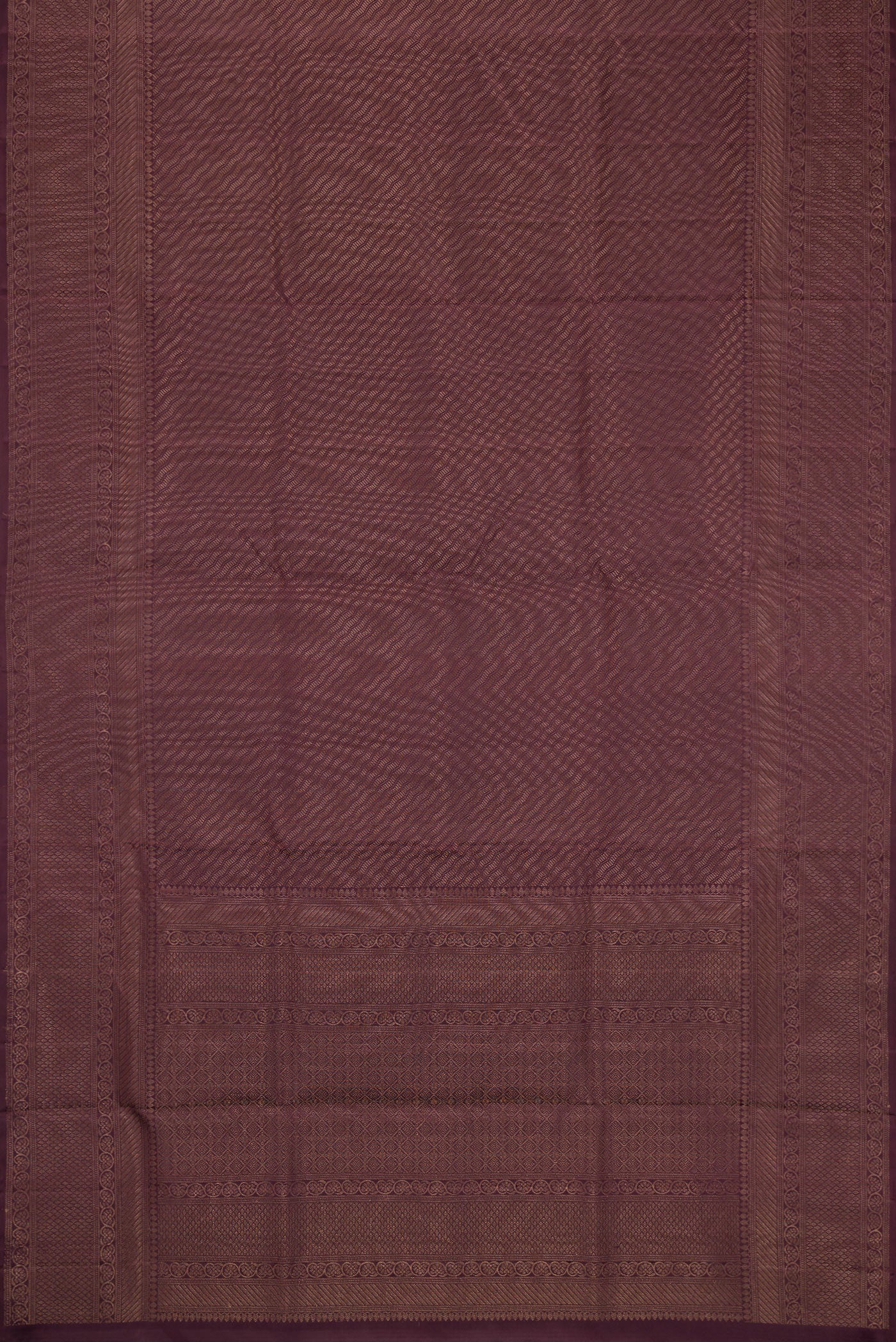 Flat view of Burgundy Dual Tone Soft Silk Saree with Zari Brocade on the body and Fancy Border. 