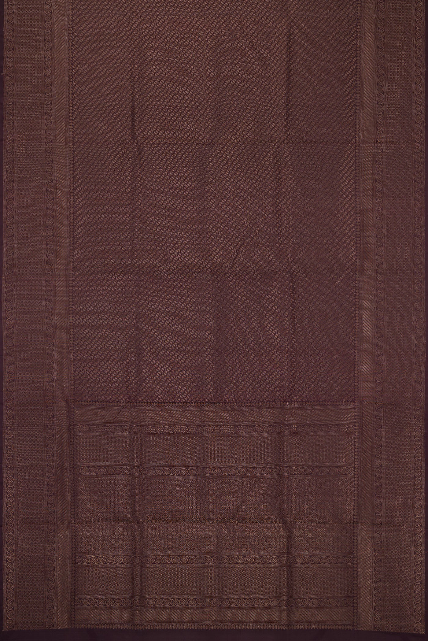 Flat view of Burgundy Soft Silk Saree with Zari Brocade on the body and Fancy Border. 