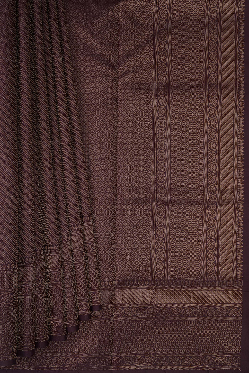 Pleats and pallu of Burgundy Soft Silk Saree with Zari Brocade on the body and Fancy Border. 
