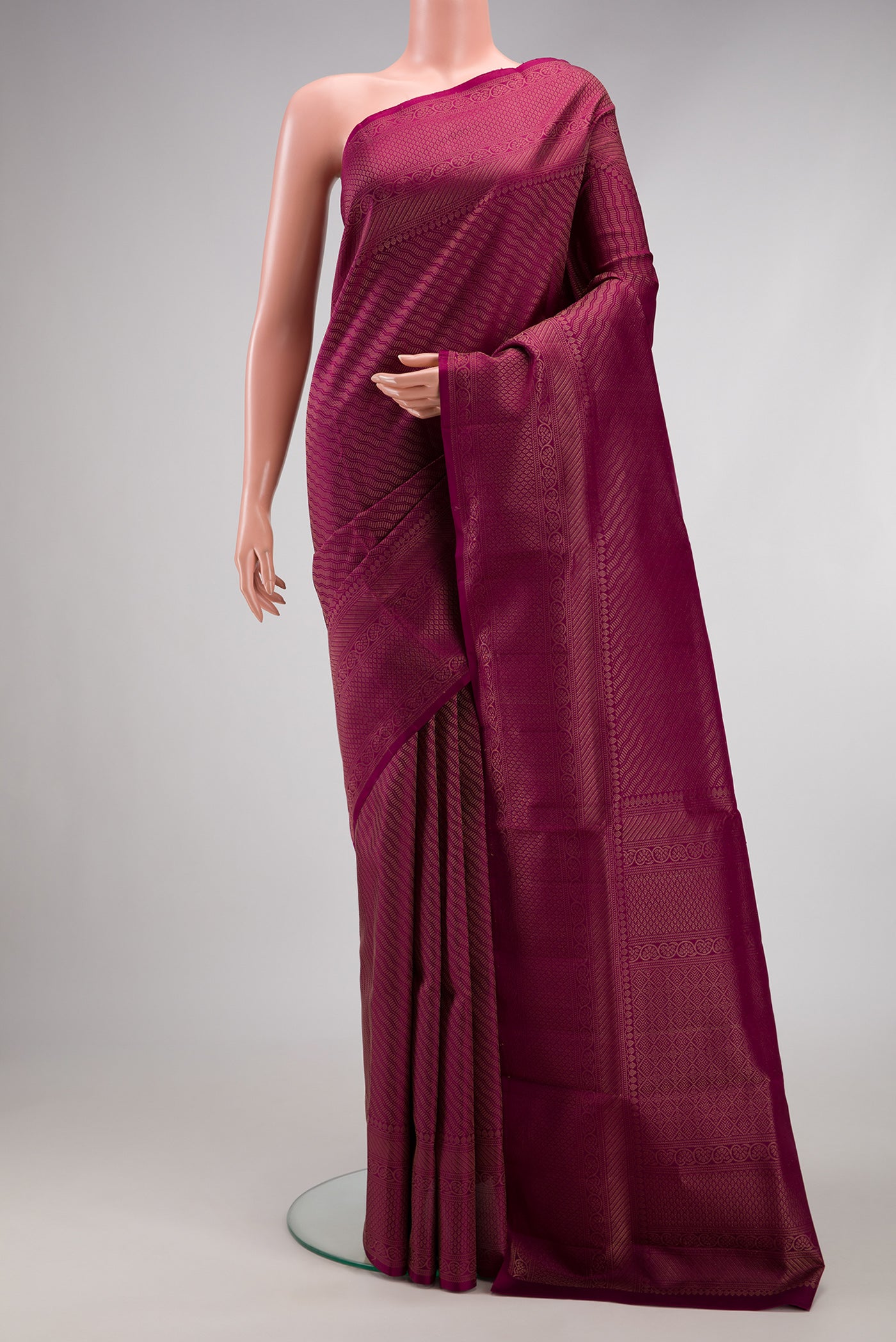 Magenta Soft Silk Saree with Zari Brocade on the body and Fancy Border.  displayed on a mannequin
