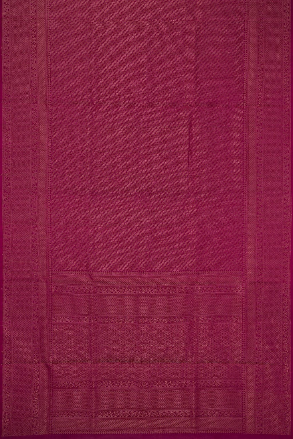 Flat view of Magenta Soft Silk Saree with Zari Brocade on the body and Fancy Border. 