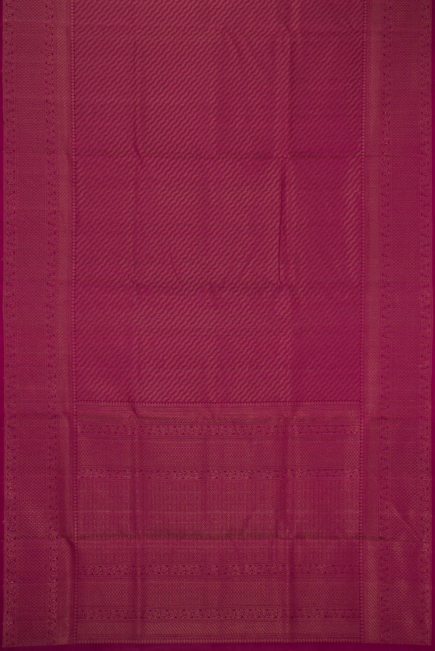 Flat view of Magenta Soft Silk Saree with Zari Brocade on the body and Fancy Border. 