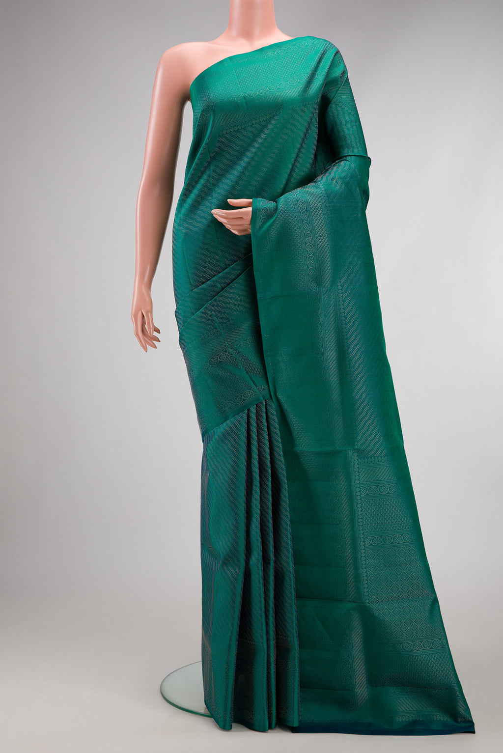 Peacock Blue Dual Tone Soft Silk Saree with Zari Brocade on the body and Fancy Border.  displayed on a mannequin