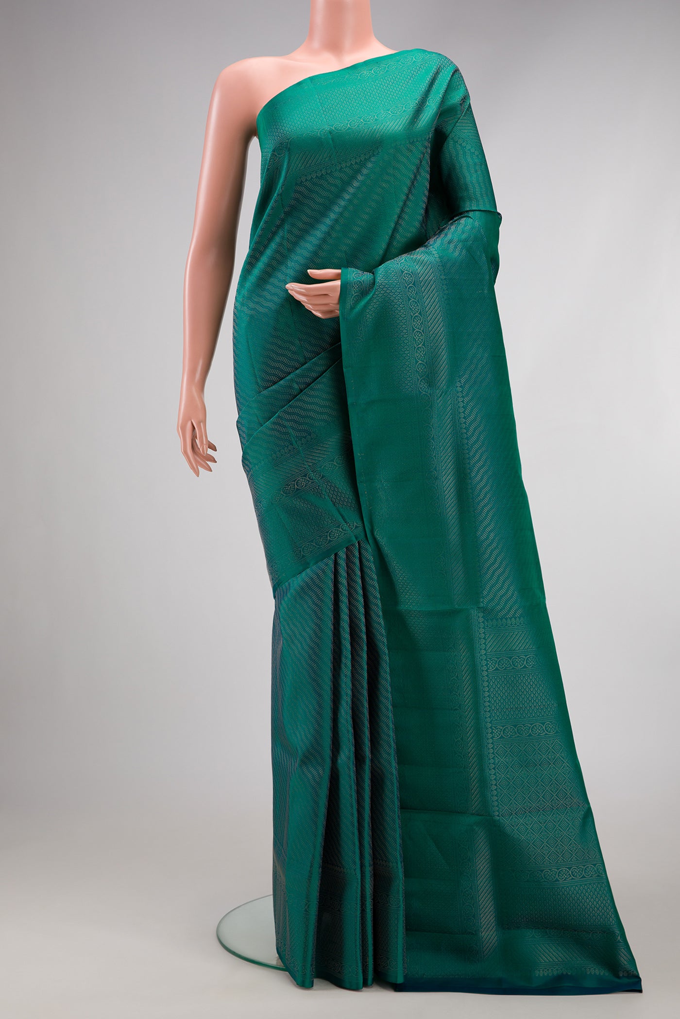 Peacock Blue Dual Tone Soft Silk Saree with Zari Brocade on the body and Fancy Border.  displayed on a mannequin