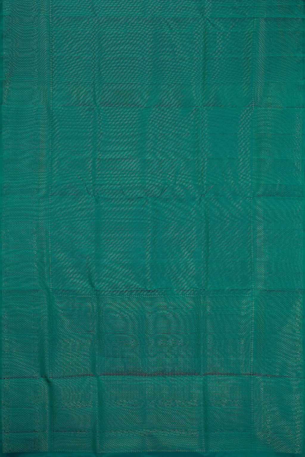 Flat view of Peacock Blue Dual Tone Soft Silk Saree with Zari Brocade on the body and Fancy Border. 