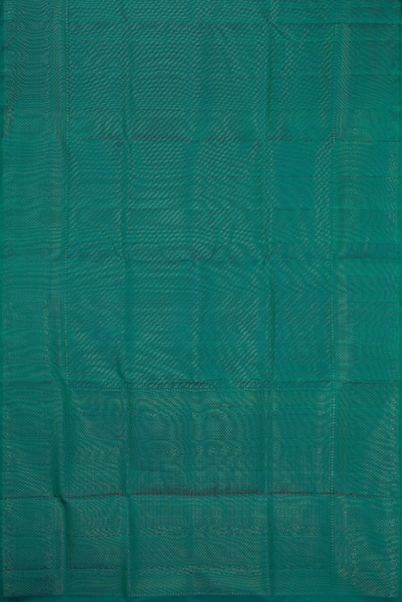 Flat view of Peacock Blue Dual Tone Soft Silk Saree with Zari Brocade on the body and Fancy Border. 
