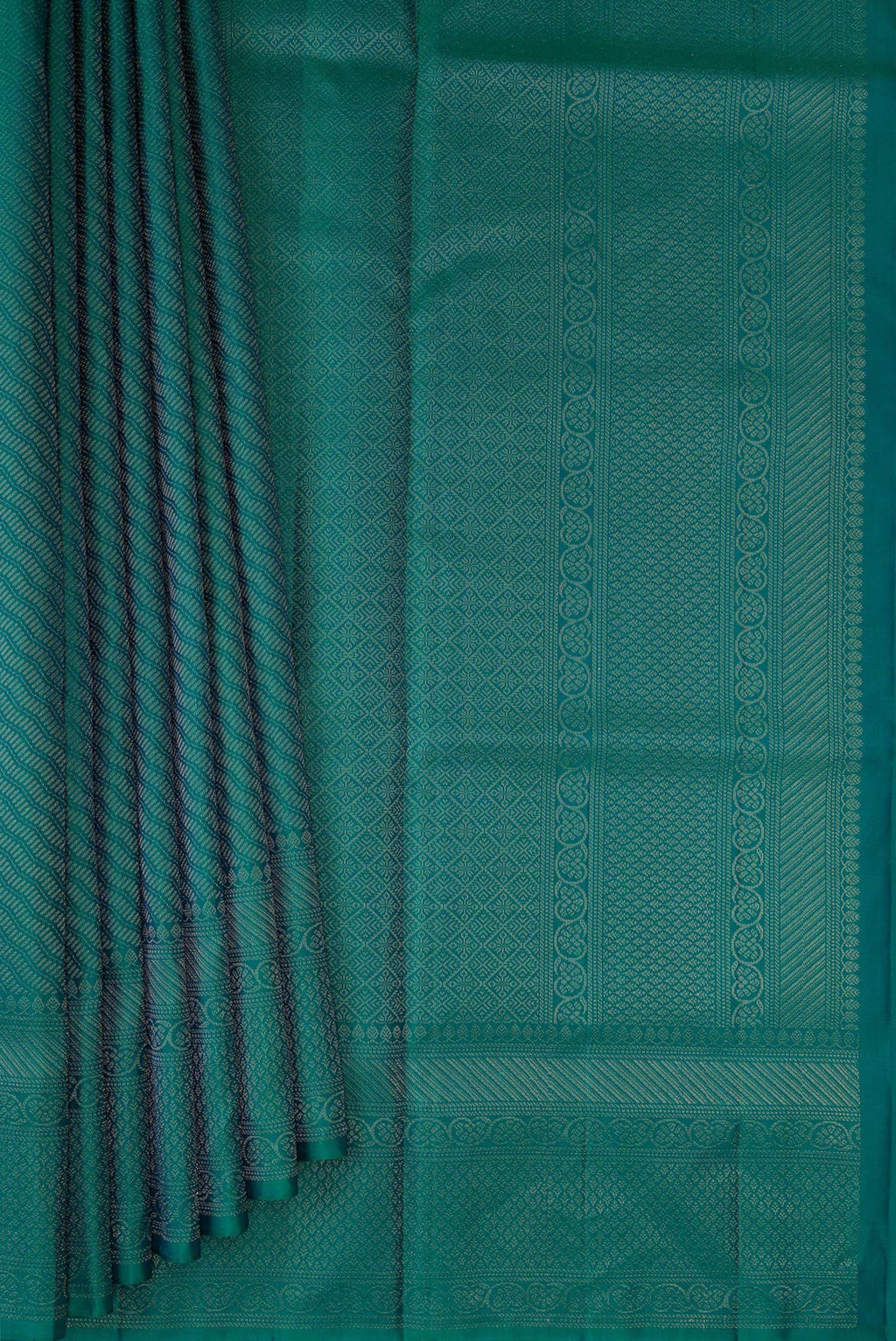 Pleats and pallu of Peacock Blue Dual Tone Soft Silk Saree with Zari Brocade on the body and Fancy Border. 