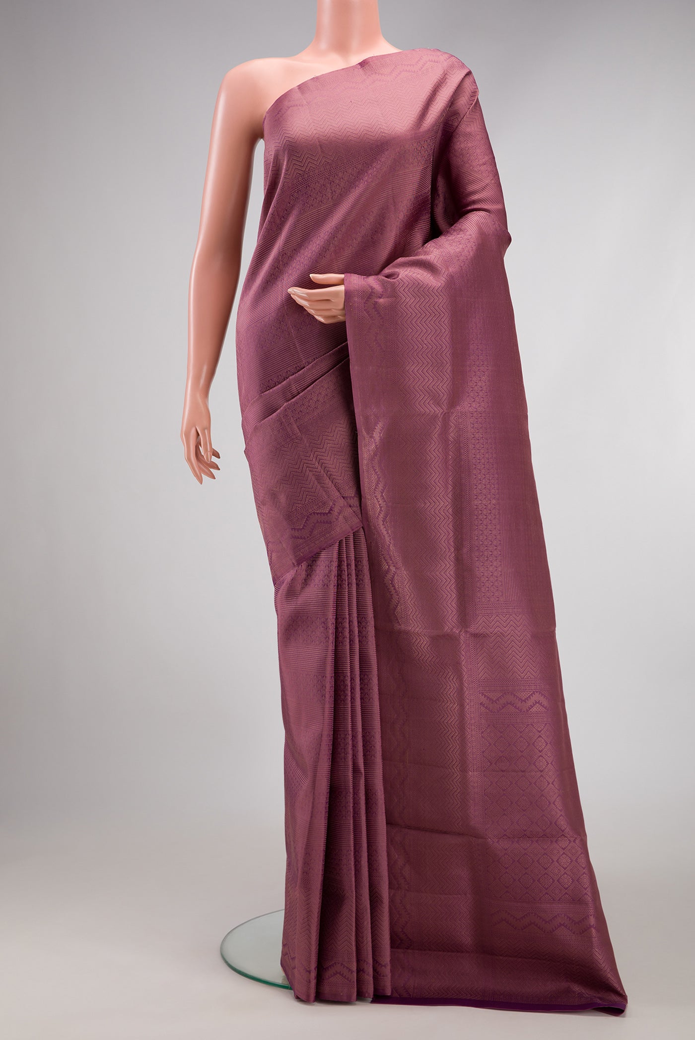 Purple Soft Silk Saree with Zari Brocade on the body and Fancy Border.  displayed on a mannequin