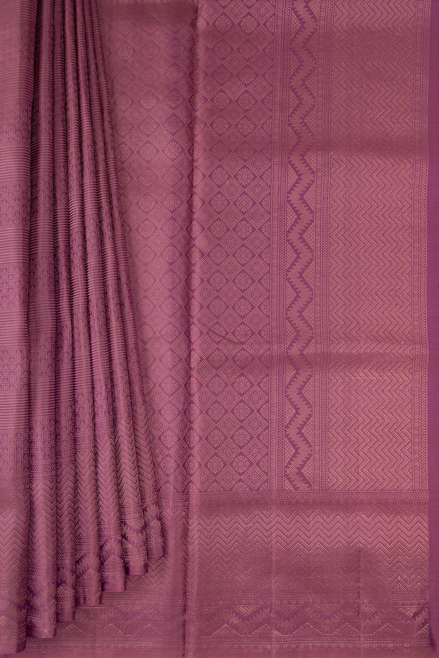 Pleats and pallu of Purple Soft Silk Saree with Zari Brocade on the body and Fancy Border. 