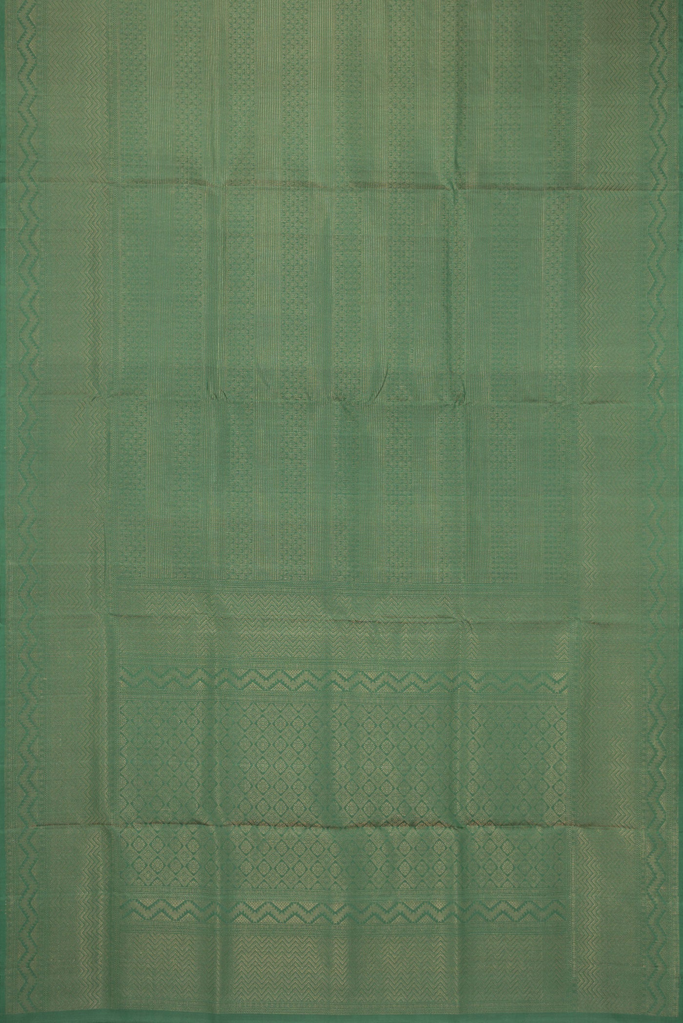 Flat view of Green Soft Silk Saree with Zari Brocade on the body and Fancy Border. 