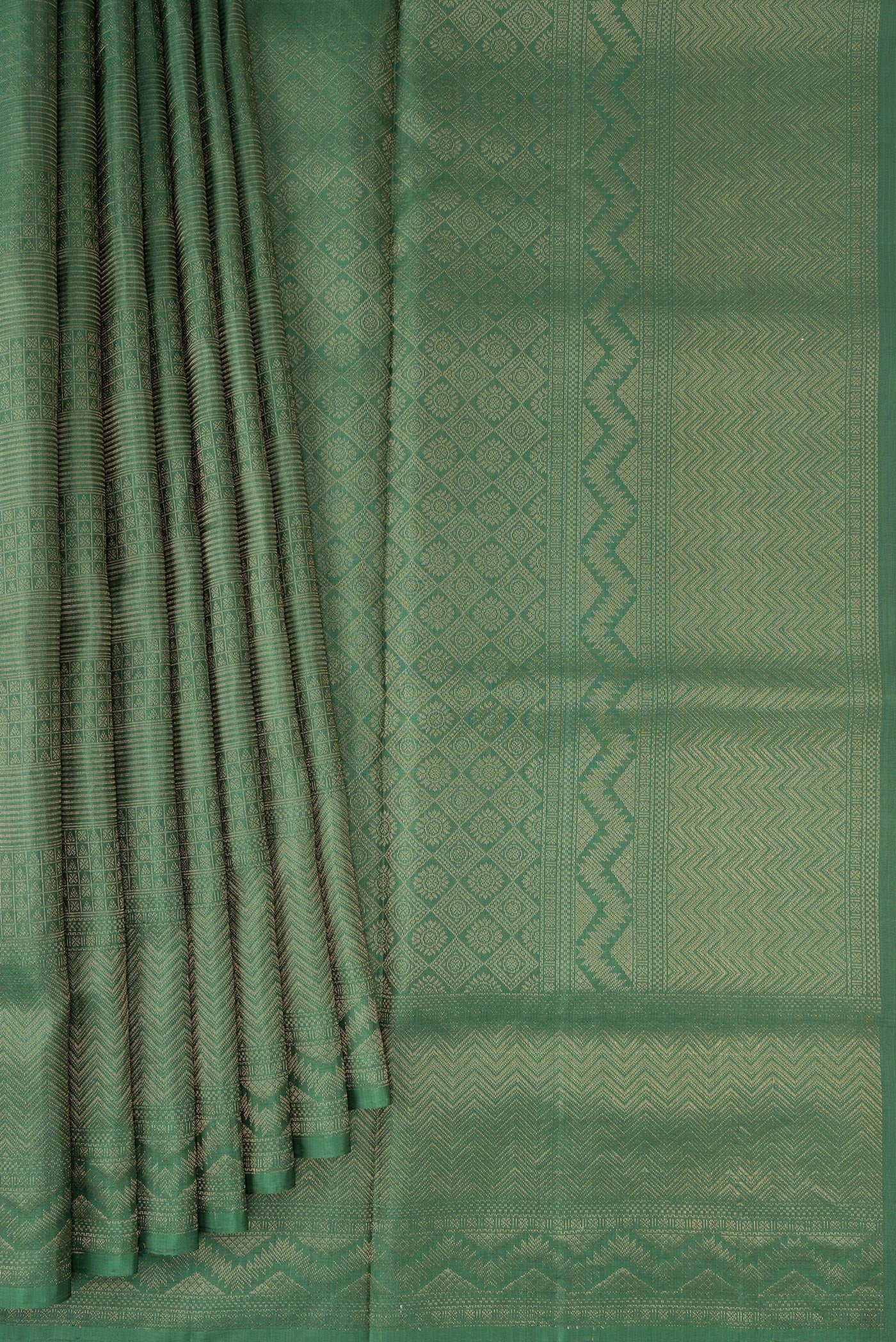 Pleats and pallu of Green Soft Silk Saree with Zari Brocade on the body and Fancy Border. 