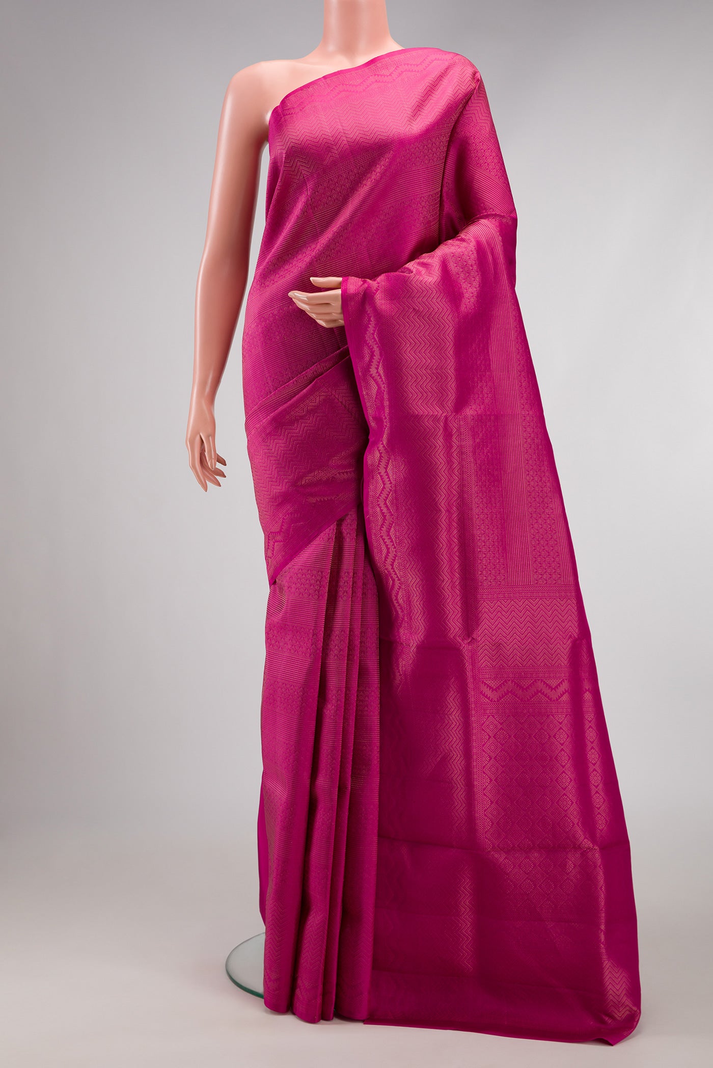 Magenta Soft Silk Saree with Zari Brocade on the body and Fancy Border.  displayed on a mannequin
