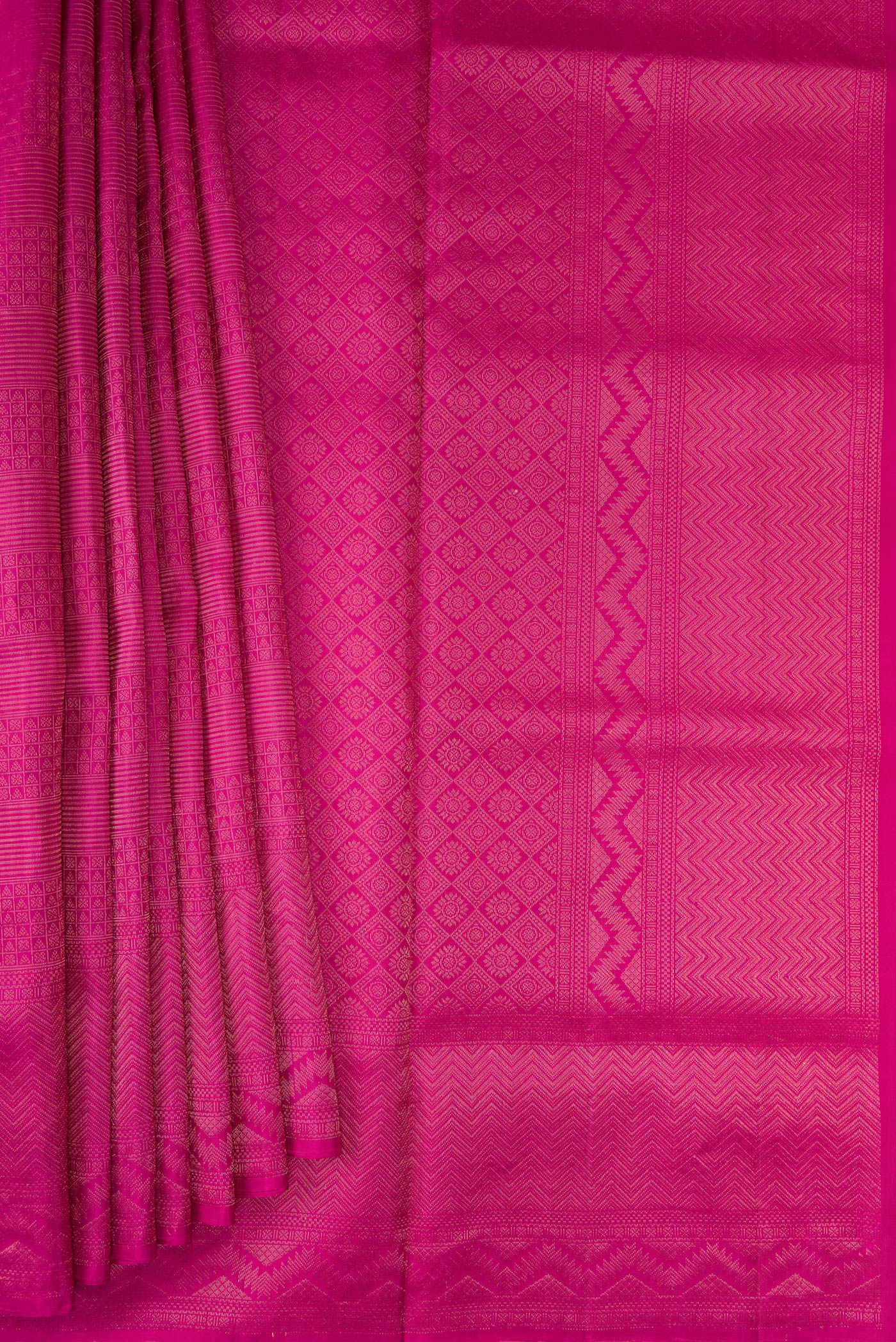 Pleats and pallu of Magenta Soft Silk Saree with Zari Brocade on the body and Fancy Border. 