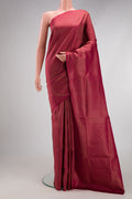 Maroon Soft Silk Saree with Zari Brocade on the body and Fancy Border.  displayed on a mannequin