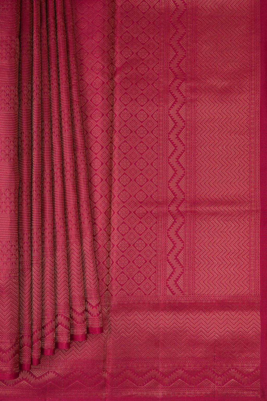 Pleats and pallu of Maroon Soft Silk Saree with Zari Brocade on the body and Fancy Border. 