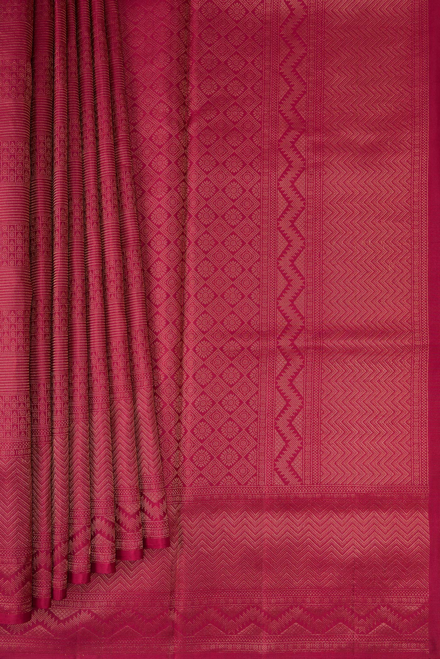 Pleats and pallu of Maroon Soft Silk Saree with Zari Brocade on the body and Fancy Border. 
