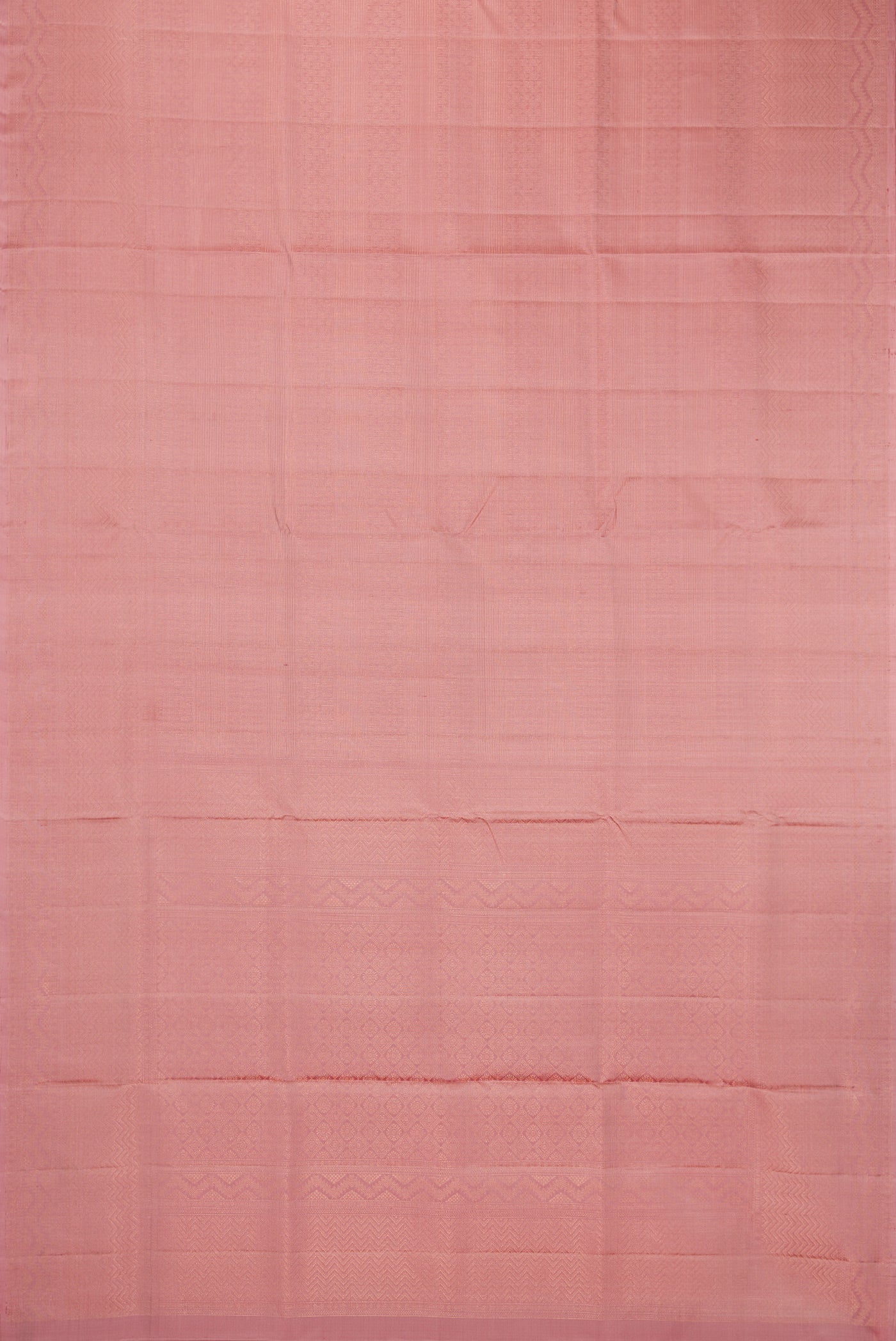 Flat view of Rose Gold Soft Silk Saree with Zari Brocade on the body and Fancy Border. 